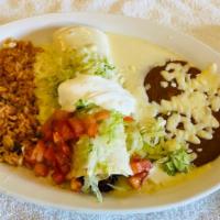 Burrito Monterey · One shredded beef burrito topped with cheese, lettuce, tomatoes and sour cream. Served with ...