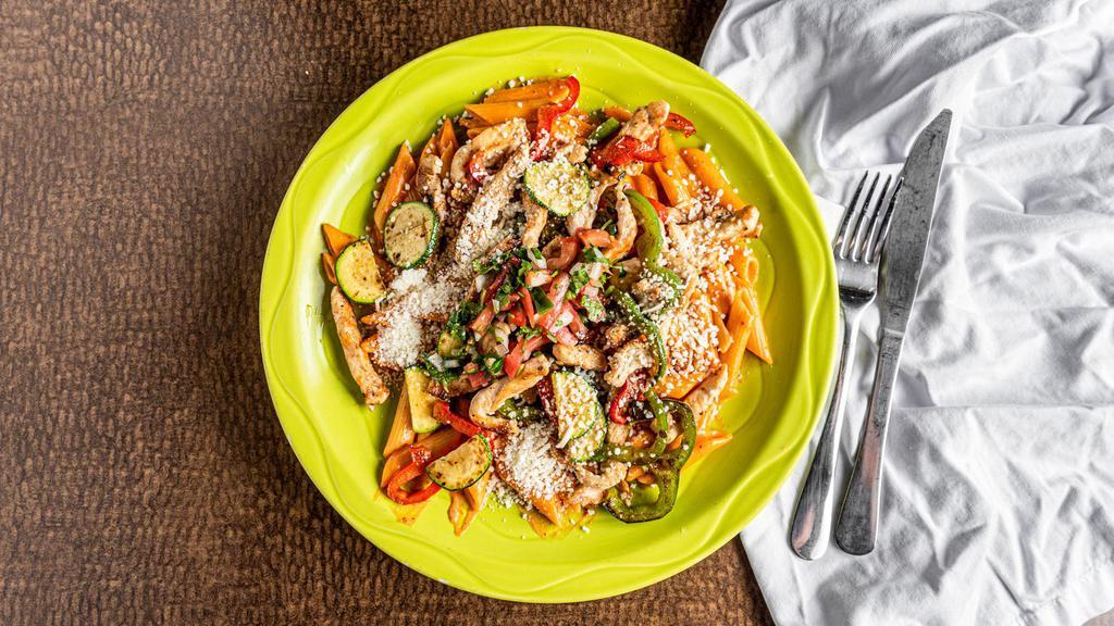 Pasta Fajitas · Penne pasta with fajita-style chicken, sautéed bell peppers, onions and zucchini in ranchero cream sauce and grated with Cotija cheese. Served with pico de gallo.