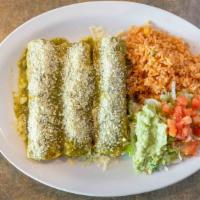 Enchiladas Verdes · Three rolled corn tortillas filled with shredded chicken. Topped with tomatillo sauce and Co...