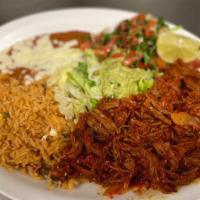 Machaca · Shredded beef. Served with rice, beans, tortillas and salad.