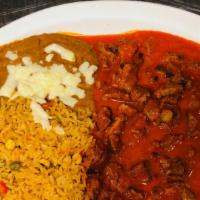 Chile Colorado · Fried beef tips with tomato sauce. Served with rice, beans and tortillas.