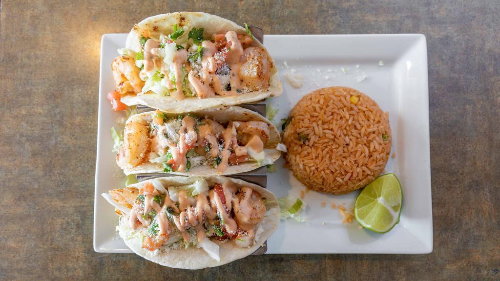 Dj Shrimp Tacos · Three tacos filled with grilled shrimp topped with chipotle sauce (not spicy), cole slaw and pico de gallo and served with rice.