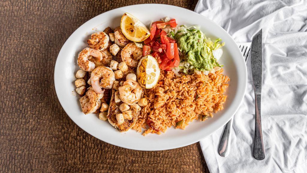 Grilled Tilapia · Tilapia fillet cooked with scallops and shrimp. Served with rice and guacamole salad.