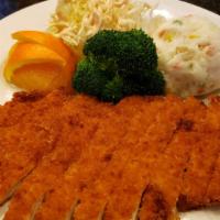 Katsu Dinner · Fried breaded cuts of chicken served with side sauce, vegetables and rice.