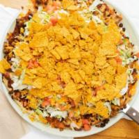 Nacho Joe · Spicy nacho cheese, taco-seasoned beef and sausage, topped with lettuce, tomatoes, and taco ...