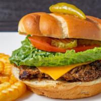 Jerk Turkey Burger · Gourmet jerk flavoured turkey burger with tomatoes, caramelized onions, lettuce, pickles and...