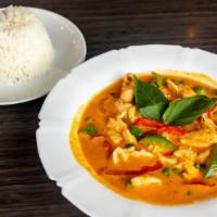 Panang Curry · Bell peppers, basil leaves, and green peas. Served with white rice.