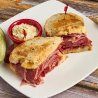 Max And Benny'S Famous Reuben · Our Delicious Corned Beef, with Sauerkraut, Swiss cheese and 1000 island grilled on Rye. wit...
