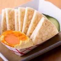 Hummus Plate · Red Mojo, cucumbers and pita bread.