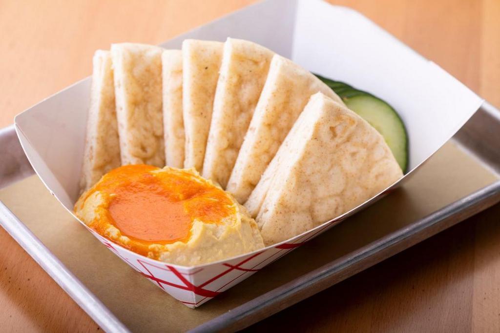 Hummus Plate · Red Mojo, cucumbers and pita bread.