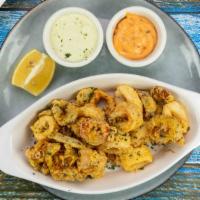 Chef C'S Calamari · Tender calamari lightly flour dusted and flash fried. Tossed with balsamic reduction and top...