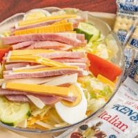 Chef Salad · Ham, turkey and cheese on lettuce, tomatoes and cucumbers with hard boiled eggs.