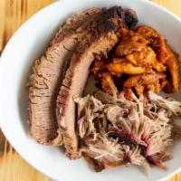 The Big Three · A serving each of Pulled Pork, sliced Beef Brisket, and sauced Apple Pulled Chicken.