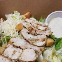 Grilled Chicken Caesar Salad · Crisp romaine lettuce, parmesan cheese, croutons and Caesar dressing with grilled chicken br...