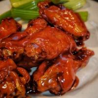 Traditional Wings (8) · Traditional wings tossed in choice of hot, 2 alarm, Cajun, BBQ, honey BBQ, Parmesan garlic a...