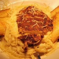 Fettuccini Alfredo · Fettuccini noodles tossed in homemade alfredo sauce and served with garlic toast. Add grille...