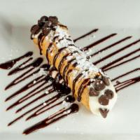 Cannoli · hard sweet shell with cream cheese and chocolate chips drizzle with chocolate syrup and powd...