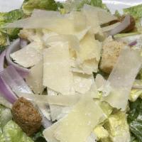 Caesar Salad · Crisp romaine, shaved Parmesan, red onion, and garlic croutons tossed in creamy Caesar dress...
