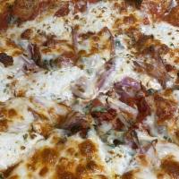 Pizza Florentine · Fresh spinach, sun-dried tomato, goat cheese, red onion, and mozzarella.  Sprinkled with Ita...