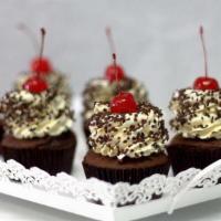 Black Forest · Chocolate cake with a cherry filling. Topped with vanilla Italian buttercream icing & chocol...