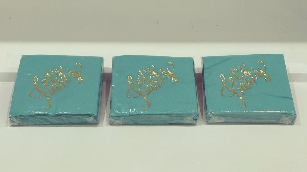 Napkins  · Teal napkins  with a gold detail 