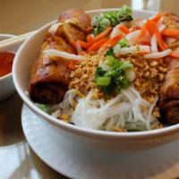 Bun Cha Gio · Rice noodles with egg rolls, served with cucumber, lettuce, and special sauce.