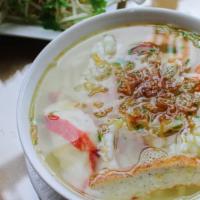 Banh Canh Seafood · Thick rice noodle soup with seafood.