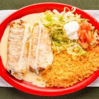 Chimichangas · Two chimichangas stuffed with your choice of chicken, ground beef or shredded beef, deep fri...