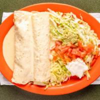 Burritos Parian · Two burritos filled with grilled beef or chicken, served with lettuce, tomatoes, onions and ...