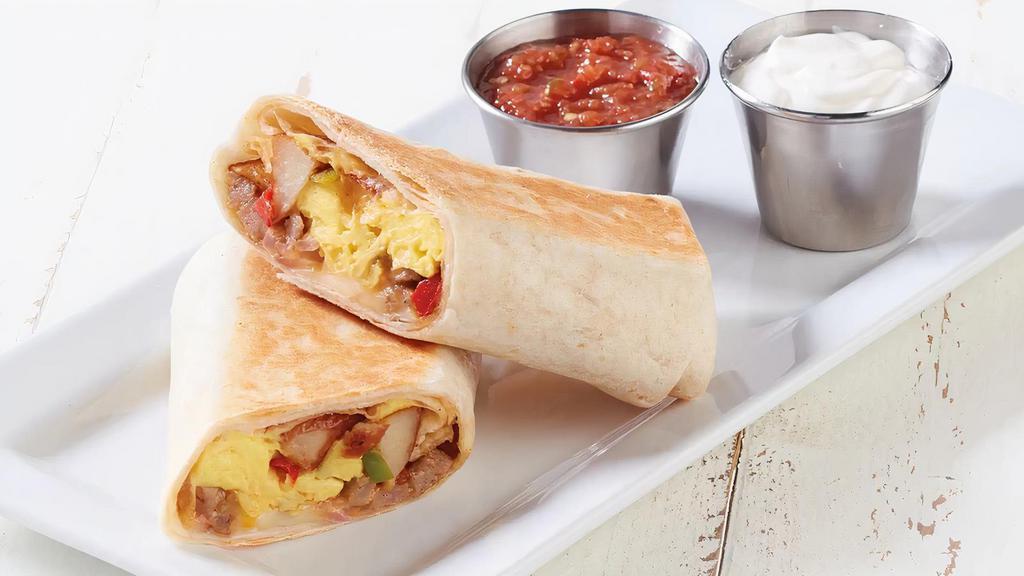Breakfast Burrito · Scrambled eggs, sausage, bell peppers, red onions, shredded cheese, breakfast potatoes in a flour tortilla. Served with salsa and sour cream