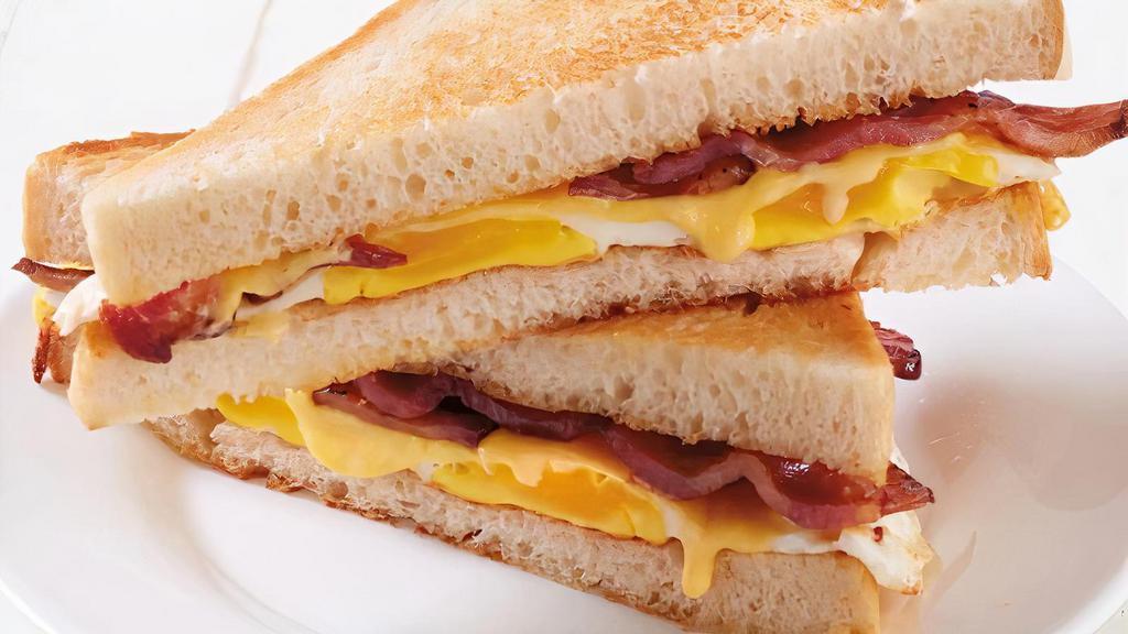 Farmhouse Sandwich · Two eggs, bacon, American cheese, sourdough bread (790 cal.)