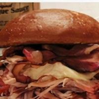 Hog Wild Sandwich · Juicy, tender ham and our famous pulled pork topped with melted provolone cheese and two str...
