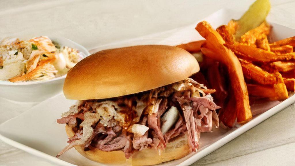 Sweet Carolina Sandwich · Tender and juicy hickory smoked pulled pork topped with tangy southern-style coleslaw and drizzled with suh-weet Carolina mustard sauce.