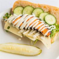 Cedar Plank Salmon Sandwich · asian marinated salmon, swiss cheese, cucumber, arugula and lemon aioli, demi baguette.