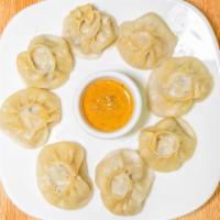 Pork Momo · pork marinated in traditional Bhutanese or Nepali herbs, spices wrapped in multipurpose flou...