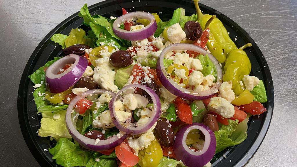Greek Salad · Romaine lettuce, feta cheese, kalamata olives, tomatoes, red onion, banana peppers and pepperonicini peppers.  Ken’s Simply Greek Vinaigrette dressing.