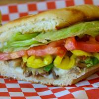 Veggie Sub · Provolone Cheese, Mushroom, Green Peppers, Onion, Lettuce, . Tomato, Banana Peppers and Ital...