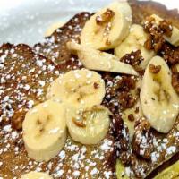 Banana Bread · 3 slices of home made banana bread French toast topped with slices of bananas and candied wa...