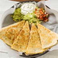Quesadillas · Flour tortilla, filled with choice of meat, melted cheese, guacamole, pico de gallo and sour...