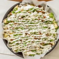 Papas La Tiendita · Loaded French fries with al pastor on asada melted cheese and sour cream.