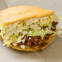 Gorditas · Fried handmade corn tortilla filled with choice of meat, lettuce and fresco cheese.