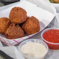 Falafel · comes with hummus on the base, 6 made in house falafel, 1 pitas on the side, our four main g...