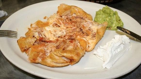 Chimichanga Dinner · Fried Burrrito with your choice of Protein. Served with rice, beans, sour cream and guacamole.