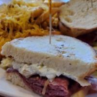 George'S Philly · Corned beef and sautéed onions topped with a creamy mozzarella and dill-mayo mix served on P...