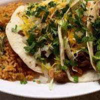 Taco Dinner (3) · Three Tacos with your Choice of Stuffing Accompanied with Rice and Beans.
