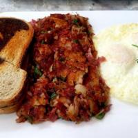 Homemade Corned Beef Hash · Three eggs, grilled onions, grilled peppers, American fries and corned beef mixed all togeth...