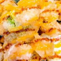 Sumo Roll · Fresh tuna, cream cheese with tempura flakes, sliced avocado and sweet crab salad on top， wi...