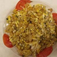 Eggs With Potatoes · Scrambled eggs with fried cubed potato and parsley. Includes two pieces of bread.