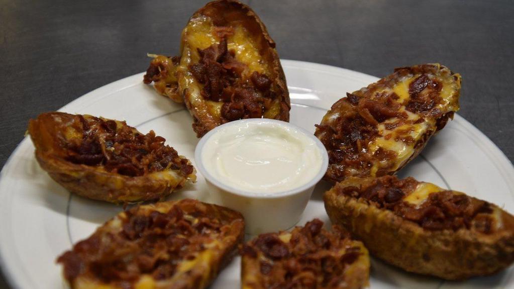 Potato Skins · Skins, Loaded with cheese and bacon served with sour cream