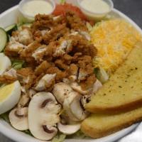 Fried Chicken Breast Salad · Chicken breast fried golden brown and served atop iceberg lettuce, tomato, cucumber, mushroo...